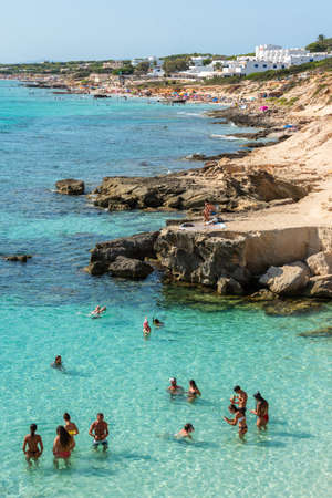 Formentera, Spain: 2021 June 04: People in Formentera beach of Calo d es Mort in Balearic Islands in summer 2021のeditorial素材