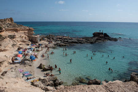 Formentera, Spain: 2021 June 04: People in Formentera beach of Calo d es Mort in Balearic Islands in summer 2021のeditorial素材