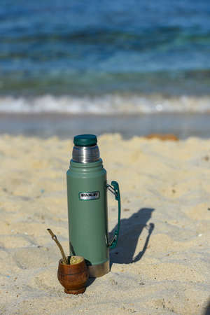 Formentera, Spain: 2021 September 19: Typical Mate Infusion Argentina, Uruguayan, Paraguayan and Brazilian accompanied by Termo Stanley on the Beach in 2021.のeditorial素材