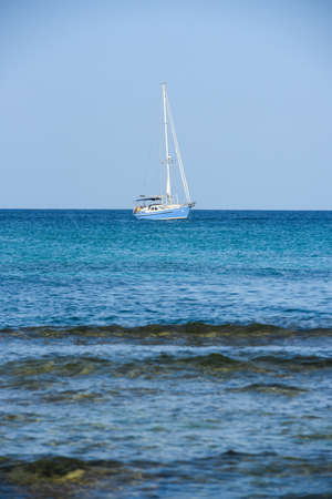 Es Pujols, Formentera, Spain: 2021 August 06: Boats beach in Formentera, Spain in the summer of 2021.のeditorial素材