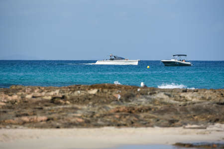 Es Pujols, Formentera, Spain: 2021 August 06: Boats beach in Formentera, Spain in the summer of 2021.のeditorial素材