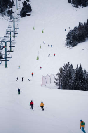 Grandvalira, Andorra: January 2021: People skiing in the Grandvalira Pyrenees station in winter 2021 - 2021.のeditorial素材