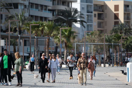 Ibiza, Spain : 2022 April 18: People in the street at Eivisa City on Ibiza Island in Spain in the summer of 2022.のeditorial素材