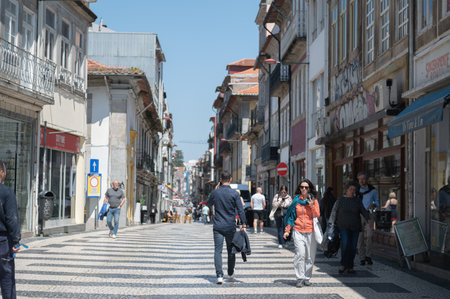 Port, Portugal. 2022 May 4 . People walking in the street in Porto on a sunny day in summer 2022.のeditorial素材