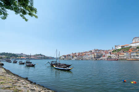 Port, Portugal. 2022 May 26 . Boat with tourists from LuÃ­s I Bridge on a sunny day in Porto, Portugal.のeditorial素材