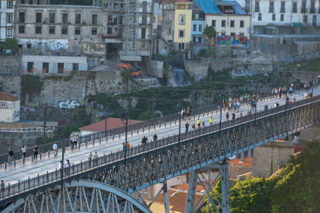 Port, Portugal. 2022 05 May . People on the Bridge over the Douro Luis II River in Porto, Portugal in Summer 2022.のeditorial素材