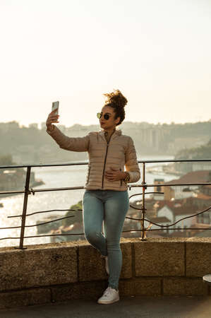Port, Portugal. 2022 May 06 . Woman Taking a photo at Jardim do Morro in the summer of 2022.のeditorial素材