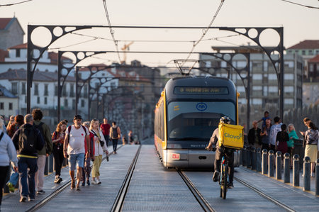 Port, Portugal. May 05, 2022. Porto Metro on the bridge over the Douro Luis II river in Porto, Portugal in the summer of 2022.のeditorial素材