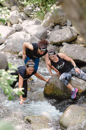 Encamp, Andorra : 2022 June 11 : Competitors participate in the 2020 Spartan Race obstacle racing...