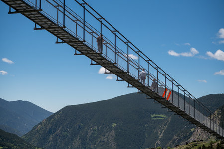 Canillo, Andorra. 2022 June 9. People walking on the longest Tibetan bridge in Europe, 600 meters...