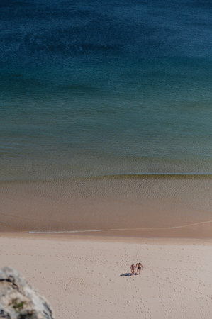 Sagres, Portugal. 2022 May 7 . People at Praia da Mareta Sagres in the Algarve, Portgual.のeditorial素材