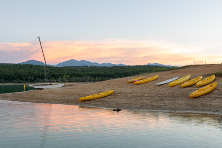 Sunset on Lake Montbel in Ariege with the boats in the summer of 2022.の写真素材