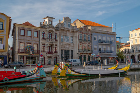 Aveiro, Portugal. 2022 May 12 . Traditional boats in the canal of Aveiro, Portugal. The colorful Moliceiro de Aveiro boat tours are popular with tourists to enjoy views of the charming canals. Aveiro, Portugal.のeditorial素材