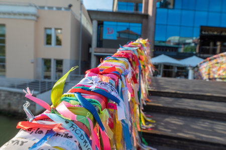 Aveiro, Portugal. 2022 May 12 . Colorful ribbons on the bridge seen from a boat in the canal of Aveiro, Portugal. Beautiful sunny day with blue sky.のeditorial素材