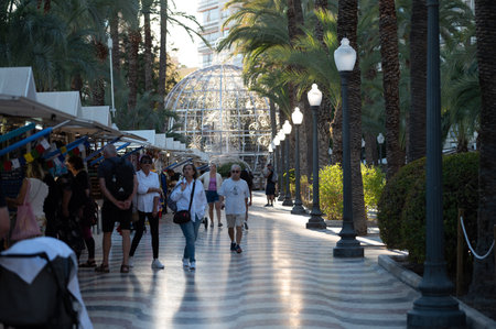 Alicante, Spain : 2022 November 18 : Tourists on the Paseo Maritimo in the touristic city of Alicante in Spain in 2022.のeditorial素材