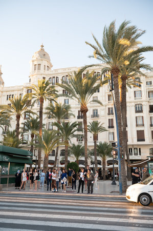 Alicante, Spain : 2022 November 18 : People walking on the Paseo Maritimo in the touristic city of Alicante in Spain in 2022.のeditorial素材