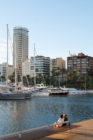 Alicante, Spain : 2022 November 18 : People walking on the Paseo Maritimo in the touristic city of Alicante in Spain in 2022.のeditorial素材