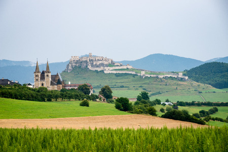 old fortress view from far away in autumn with colorful environmentの写真素材