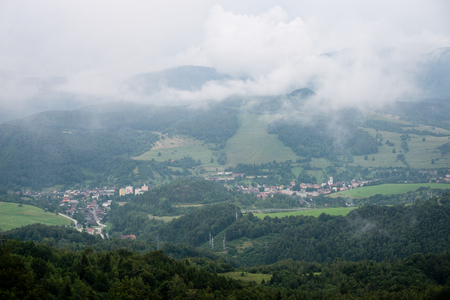 small mountain city view in romania from above in autumn with colorful environmentの写真素材