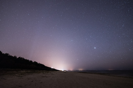 night sky with stars on the summer beach. space view from earthの写真素材