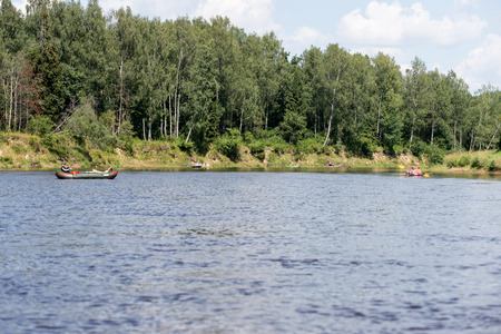 tourists enjoying water sports, kayaking in wild river - Sigulda, Latviaのeditorial素材