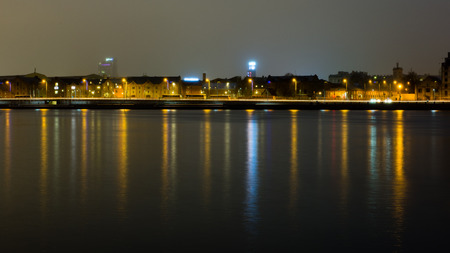 city light reflections over water at the night. Riga, Latviaの写真素材