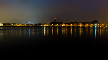 city light reflections over water at the night. Riga, Latviaの写真素材