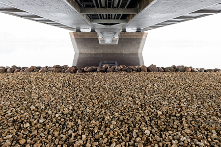 colorful Night skyline on the river with bridge and reflections in Riga, Latviaの写真素材