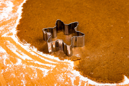 Making Gingerbread Cookies Series. Preparing and cutting dough sheet into shapes.