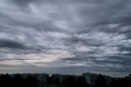colorful sunset in the sea with reflections and cloudsの写真素材