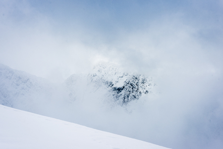western carpathian mountain tops in winter covered in snow on a sunny day. slovakiaの写真素材