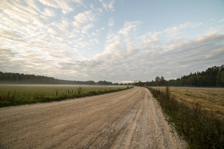 Majestic country landscape under morning sky with clouds.の写真素材