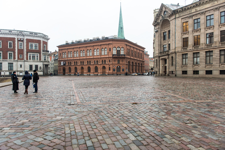 panoramic misty street view of old city center of riga, latviaのeditorial素材