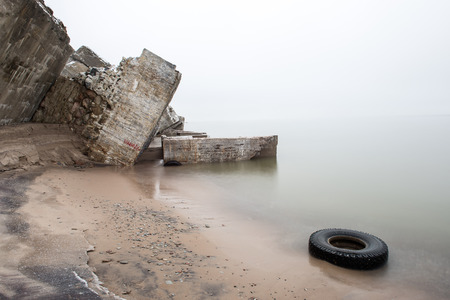 old war fort ruins on the beach in winter. Liepaja, Latviaの写真素材
