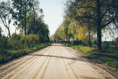 empty country road with perspective Retro grainy color film look.の写真素材