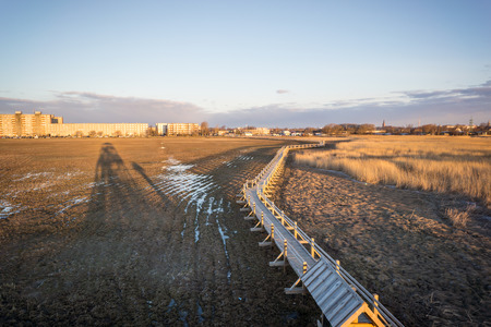 beautiful sunrise over the lake in country with warm colors and reflectionsの写真素材