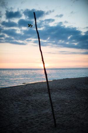 red and orange dramatic sunset on the sea beach with colorful skyの写真素材