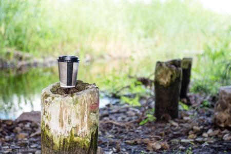 coffee cup in abandoned river bank on the poleの写真素材