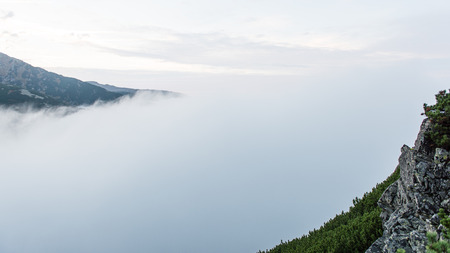 Tatra mountains in Slovakia covered with clouds. autumn colors.の写真素材