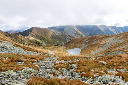 Tatra mountains in Slovakia covered with clouds. autumn colors.の写真素材