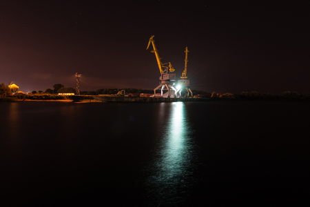 night city reflections in river, Riga, Latviaの写真素材