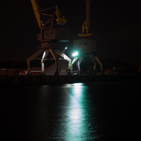 night city reflections in river, Riga, Latviaの写真素材