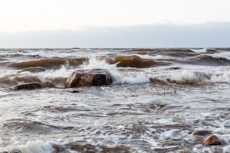 Storm large wave on the shore of the Baltic sea beachの写真素材