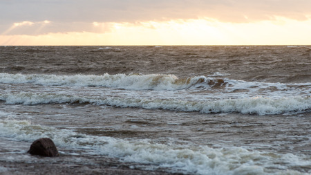 Storm large wave on the shore of the Baltic sea beachの写真素材