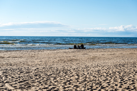 comfortable beach of the baltic sea with rocks and green vegetation in summerの写真素材