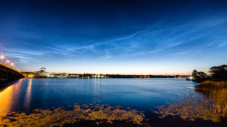 Beautiful sky phenomenon noctilucent clouds over beach in Latviaの写真素材