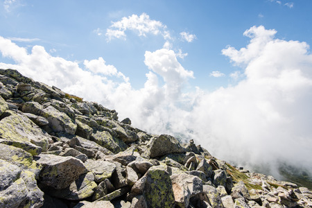 rocky mountain landscape covered with clouds and fog. High Tatra, Slovakiaの写真素材