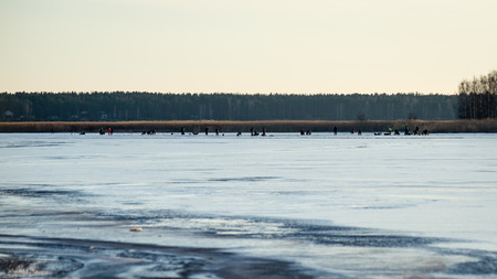people enjoying frozen beach in winters cold. walking and relaxingの写真素材
