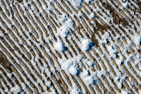 frozen sand with ice blocks. abstract texture in natural beachの写真素材
