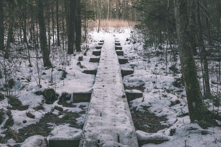 frozen countryside scene in winter with snow. tourist trailsの写真素材